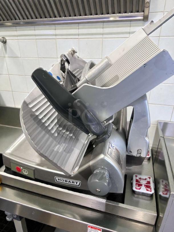 Hobart HS8 commercial meat slicer in high-grade condition, showing control knob and brand logo; 120V, tested and working.