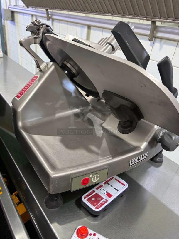 Hobart HS8 commercial meat slicer, high-grade condition, 120V, tested, shows Hobart branding and control panel.
