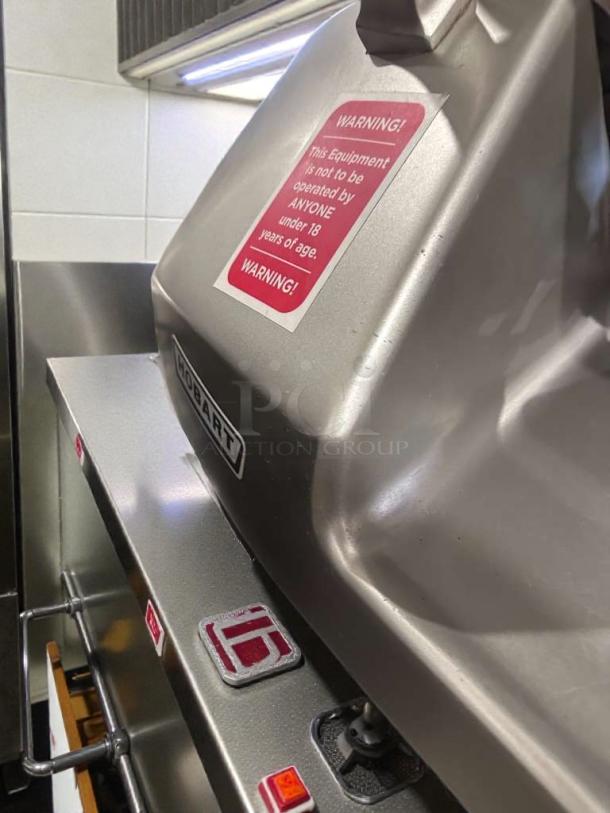 High-grade Hobart HS8 meat slicer, 120V, stainless steel, warning label, fully tested, excellent condition.