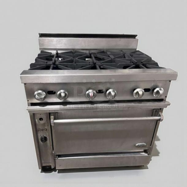 Commercial 6 burner gas range with oven, stainless steel, superior condition. Heavy duty, fully operational, model COM-L-RNG-0509.