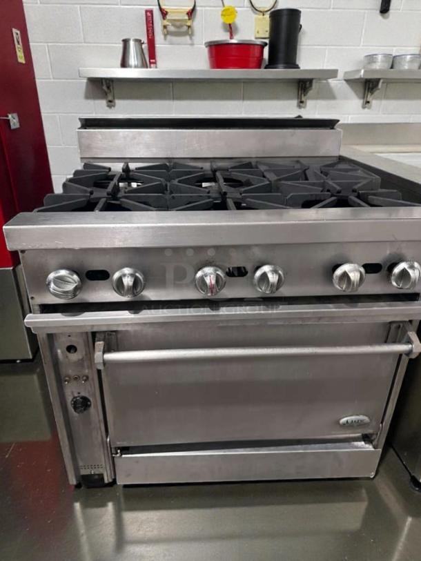 Commercial stainless steel 6 burner gas range with oven, superior condition, make: Commercial Restaurant Equipment, model: COM-L-RNG-0509.