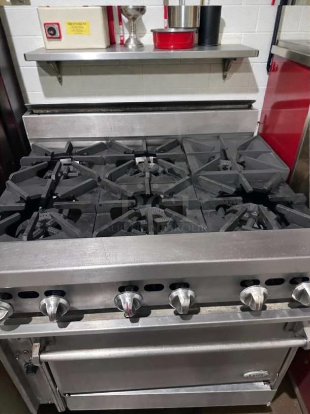 Stainless steel 6 burner gas range with standard oven, heavy-duty, excellent condition, model COM-L-RNG-0509.