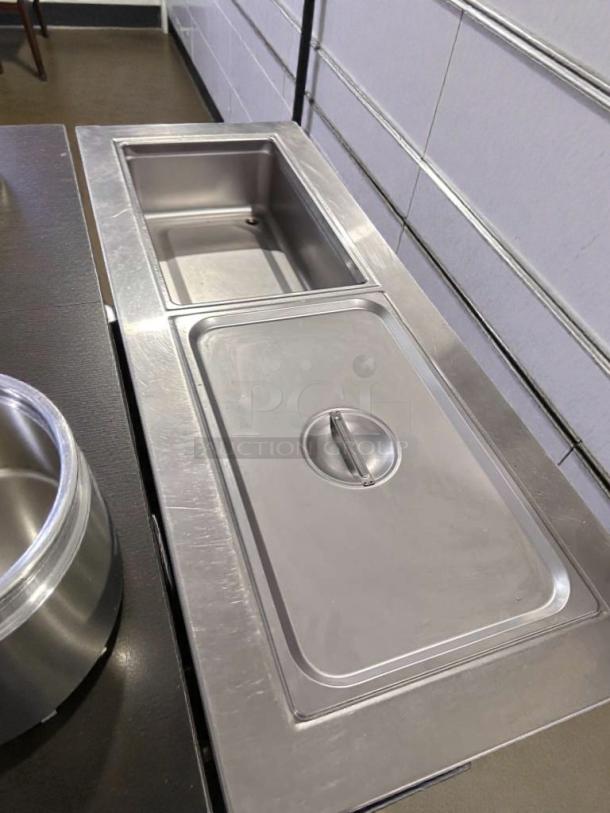 Delfield 8148-EFN refrigerated cold food table in exceptional condition, stainless steel, NSF & UL listed, fully operational.