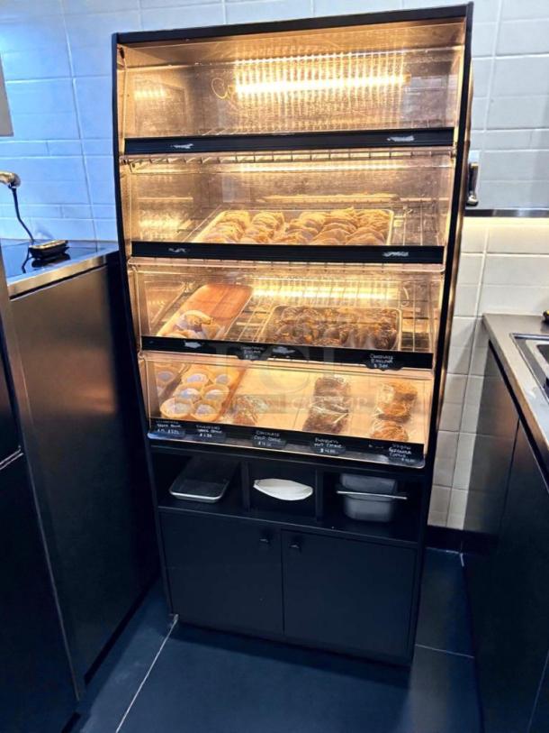 Turbo Air refrigerated bakery display case, LED lit, showcasing pastries. Model TA-L-BDC-0512. Excellent condition, fully operational.
