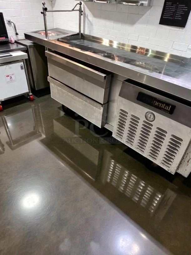 Continental Refrigerator D36GN commercial refrigerated chef base in excellent condition; features stainless steel exterior and operational gauge.