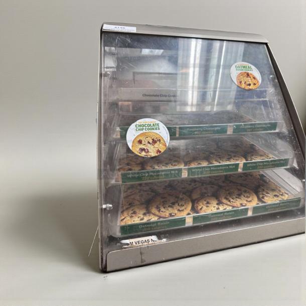 Commercial Countertop Multi-Tier Bakery Display Case, excellent condition, displaying cookies with labels, fully operational.