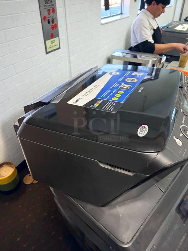Epson Stylus Photo RX595 inkjet printer, pristine condition, fully tested. Visible label shows model/brand details.