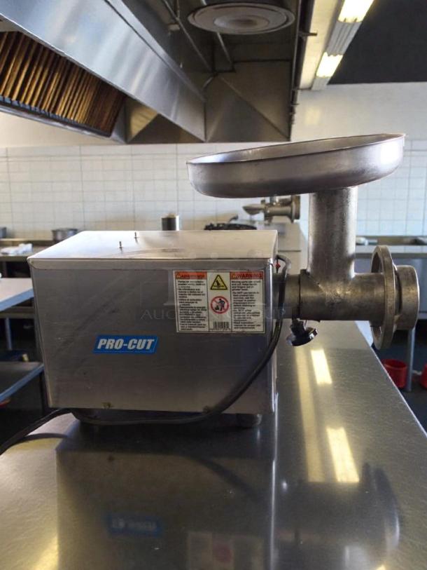 Pro-Cut KG-12FS commercial meat grinder, outstanding condition, 115V, single phase, tested and working, label visible.