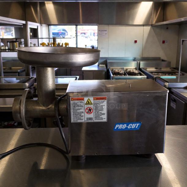 Pro-Cut KG-12FS commercial meat grinder, outstanding condition, 115V, tested and working, safety labels, stainless steel.