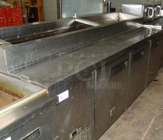 Kelvinator 24 cu. ft. pizza prep table, model KCPT92.12. Features spacious stainless steel worktop, refrigeration drawers, pre-owned.