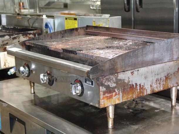 Star KCPT92.12 gas charbroiler, 36"W x 25-3/4"D x 15-1/2"H, 120,000 BTU, showing visible wear and rust on the surface.