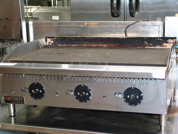 Star Patriot Platinum PT-G36-TP gas griddle, 36"W, 84,000 BTU, thermostat-controlled. Visible wear on surface. Model KCPT92.12.