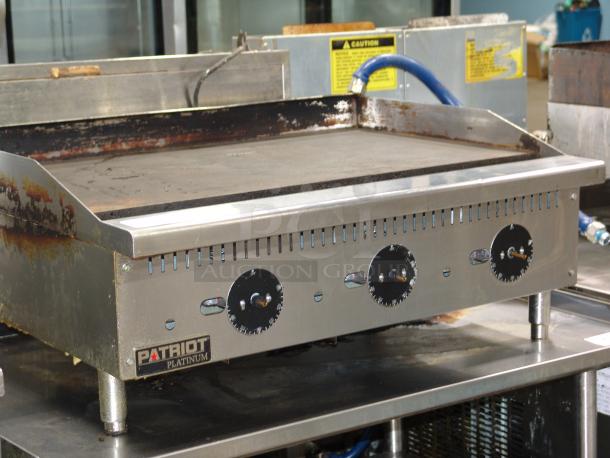 Star Patriot Platinum PT-G36-TP griddle, 84,000 BTU thermostat-controlled, 36" wide, stainless steel, some surface wear.