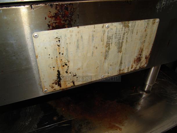 Heavily used Star gas griddle, model KCPT92.12, with visible rust and wear on the metal surface and label plate.