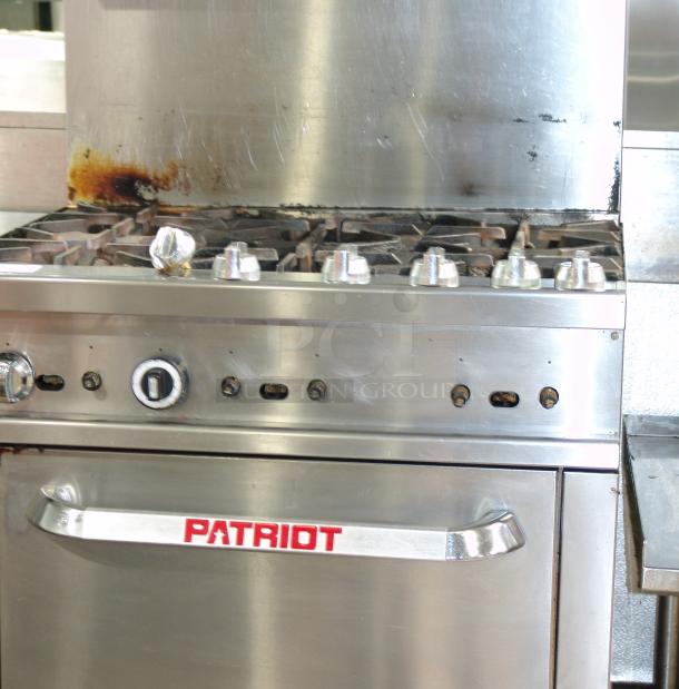 Patriot PT-R36 6-burner natural gas range, 36"W, heavy-duty, stainless steel, used condition with visible wear.