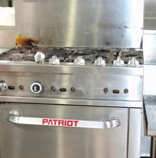 Patriot PT-R36 6-burner natural gas range, 36"W, heavy-duty, stainless steel, used condition with visible wear.