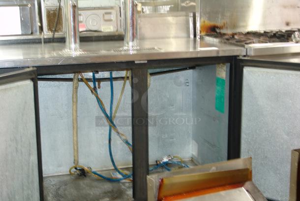 True Black Beer Dispenser TDD-2, 58-7/8"W in great condition, features chrome taps, visible wiring, and internal cooling components.