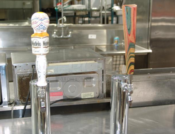 True Black Beer Dispenser, model TDD-2, in great condition with dual tap handles in a commercial kitchen.