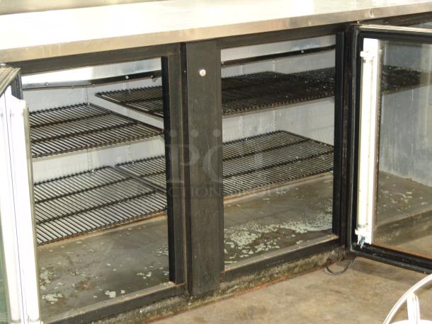 True TDD-2 bar refrigerator, 3 glass doors, black finish, excellent condition, visible interior shelving.