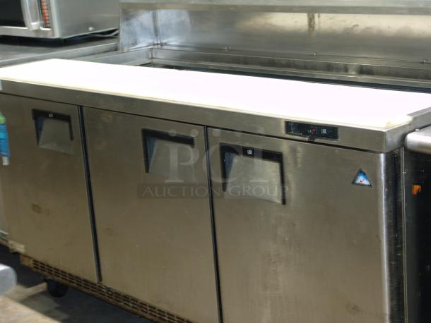 Stainless steel True TDD-2 salad prep table, 71 1/8", used condition, with refrigerated base, visible brand markings on doors.