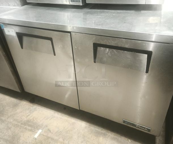 True TUC-48 heavy-duty undercounter commercial refrigerator, stainless steel, dual-door, good condition with minor wear.