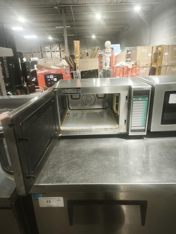 Sharp R21LVF stainless steel commercial microwave, open door, touch controls, 10 programmable memories, 1,000W, 120V.