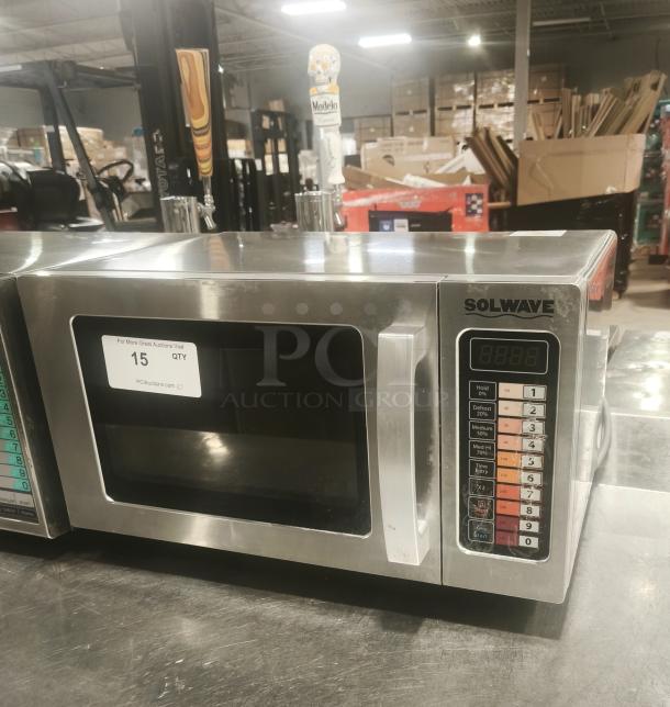 Solwave EM025FJT-S0SA00 stainless steel commercial microwave, 1000W, with push button controls, used condition, auction tag "15 QTY".