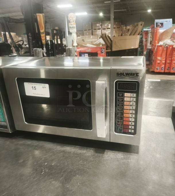 Solwave EM025FJT-S0SA00 stainless steel commercial microwave, 1000W, push-button controls, visible label with quantity.
