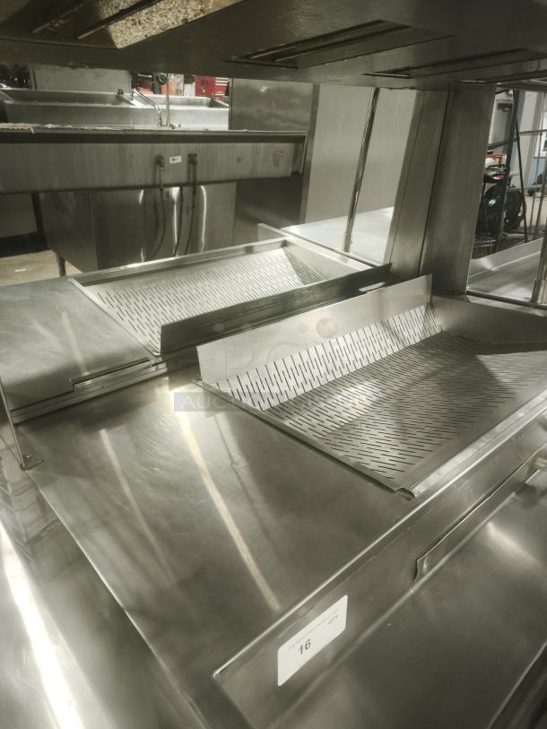 Delfield commercial refrigerator sandwich prep table in good condition with stainless steel surface and integrated cutting board.