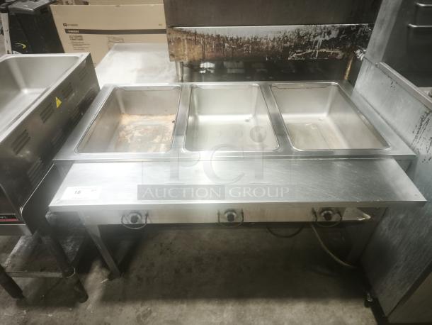 Delfield commercial 3-pan steam table in premium condition, stainless steel, with temperature controls, for hot food holding.