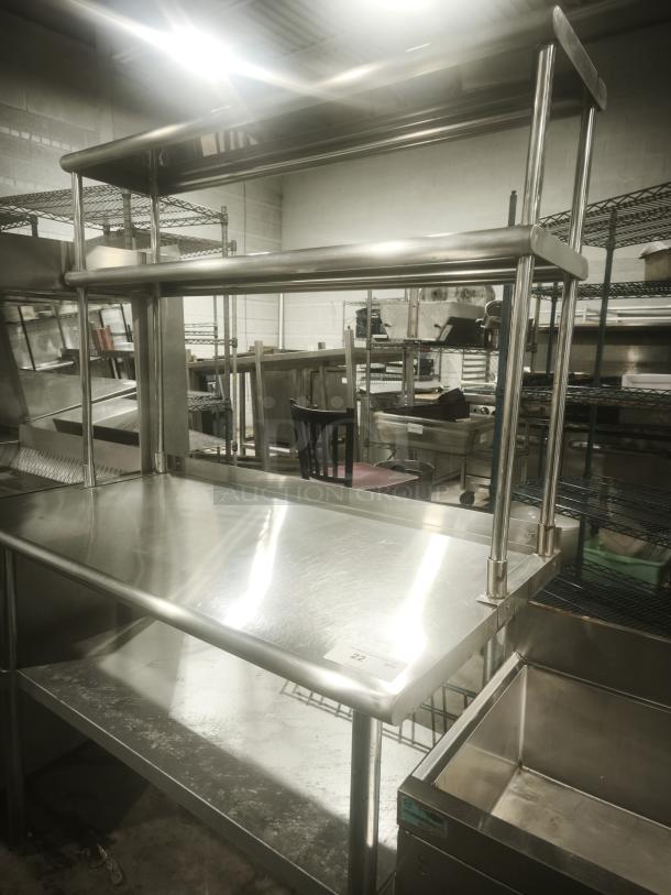 Stainless steel worktable with wide double-tier overshelf, in great condition. Ideal for kitchen prep, durable and spacious.