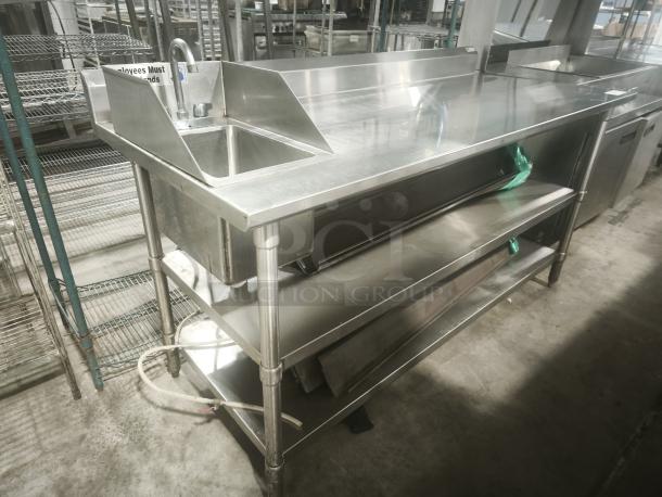 Commercial stainless steel prep table with sink, double undershelf; excellent condition, integrated faucet, durable design.