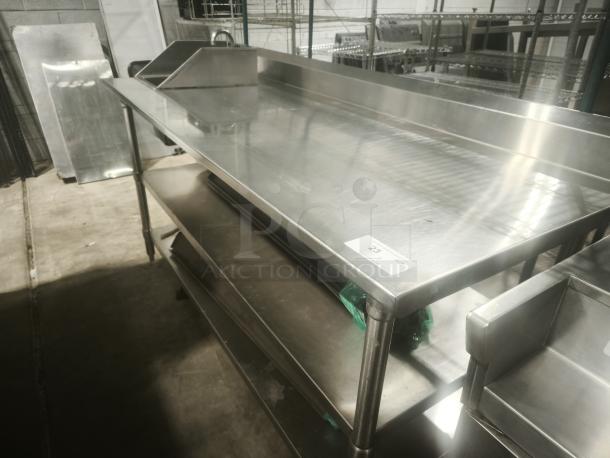 Commercial stainless steel prep table with sink, double undershelf, excellent condition, includes numbered tag 23.