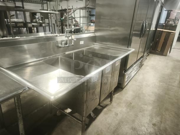 Heavy Duty stainless steel 3-compartment butcher sink, used condition, with faucet and backsplash, ideal for commercial kitchens.