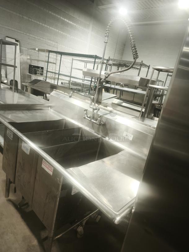Heavy-duty stainless steel butcher 3-compartment sink with high-arc faucet, industrial setting, excellent condition.