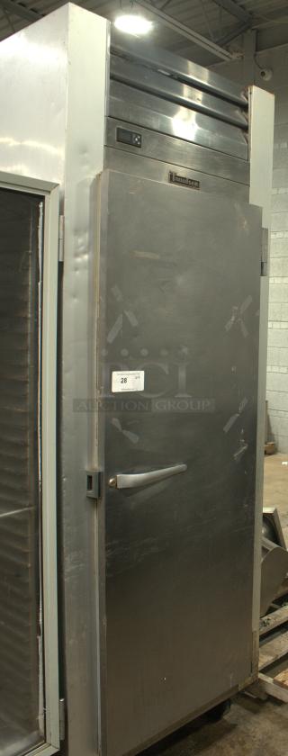 Traulsen G12010 freezer, 29 7/8", right hinge, solid door, 115v. Great condition with visible digital display and handle.