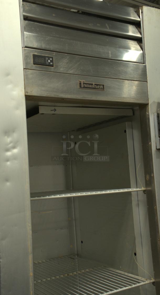 Traulsen G12010 reach-in freezer, 29 7/8", right hinge solid door, 115V, great condition, with interior shelving.