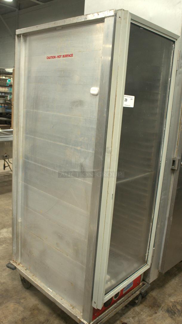 Avantco HEAT-1836I Insulated Heated Holding Cabinet with clear door, stainless steel, "Caution - Hot Surface" label visible.