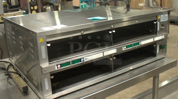 Prince Castle DHB2PT-33KFCB dual pass-through holding bin, stainless steel, excellent condition, visible control buttons.