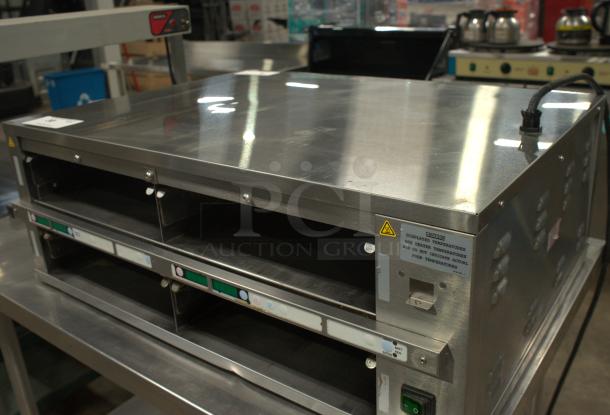 Prince Castle DHB2PT-33KFCB dual pass-through bin, stainless steel, excellent condition, visible control panel and caution label.