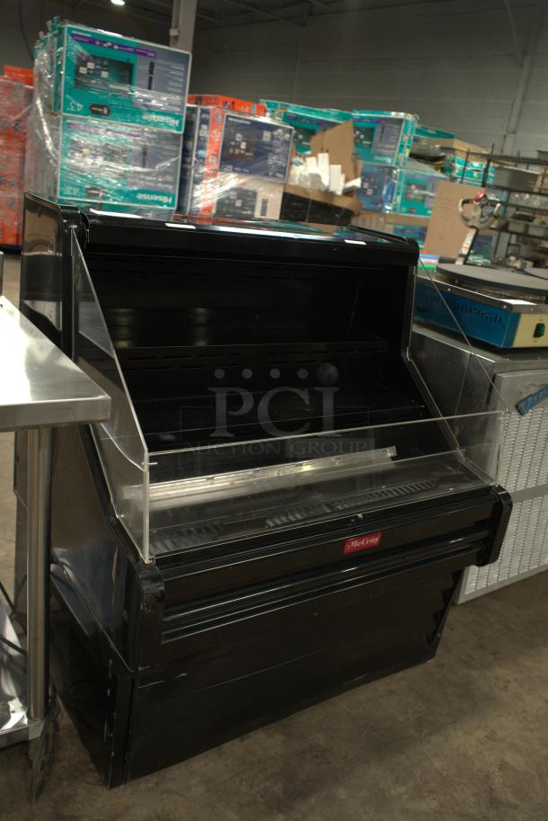 Howard-McCray 63" impulse cooler, model SC-OS35E-5C-B-LED. Black, 3 shelves, clear front, 115v, open-air design.