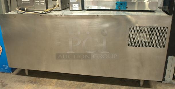 Victory 60" undercounter worktop refrigerator with two doors, in excellent condition. Stainless steel exterior, visible vent.