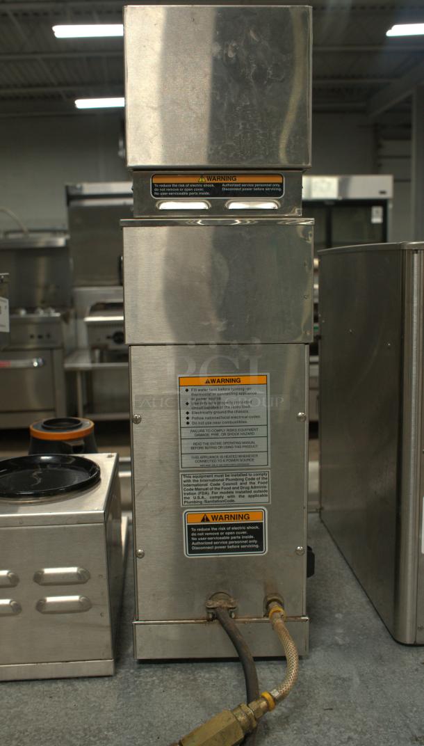 BUNN VP17-2SS Brewer, premium condition, stainless steel, visible warning labels, back view with power connections.