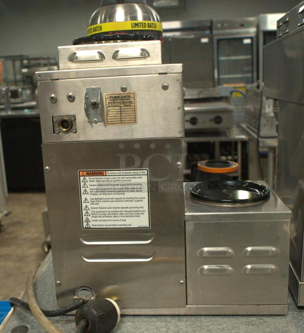 Curtis 12 Cup Coffee Brewer, model ALP5GTL12A805, in premium condition. Features 3 lower warmers on left, 120V power. Warning labels visible.