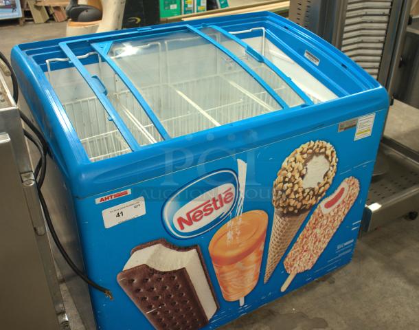 AHT RIO S 100 ice cream freezer with sliding glass top, branded graphics. Premium condition, model S 100, tag indicates auction use.