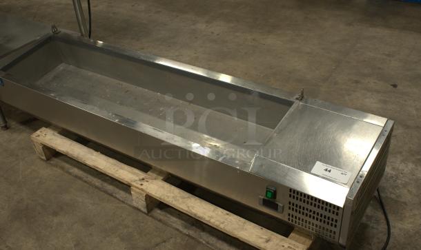 Arctic Air 63" countertop refrigerated prep rail, model ACP63, with hinged lid. Good condition, visible control panel and label.