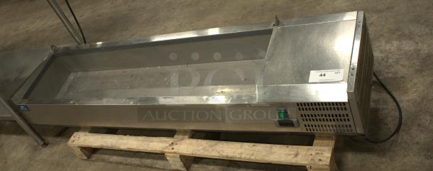 Arctic Air 63" countertop refrigerated prep rail, model ACP63, with hinged lid, stainless steel surface, good condition.
