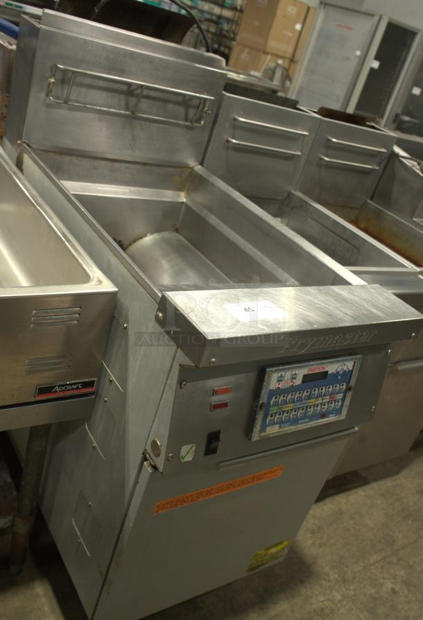 Frymaster heavy-duty commercial deep fryer, stainless steel, built-in control panel, used condition with visible wear.