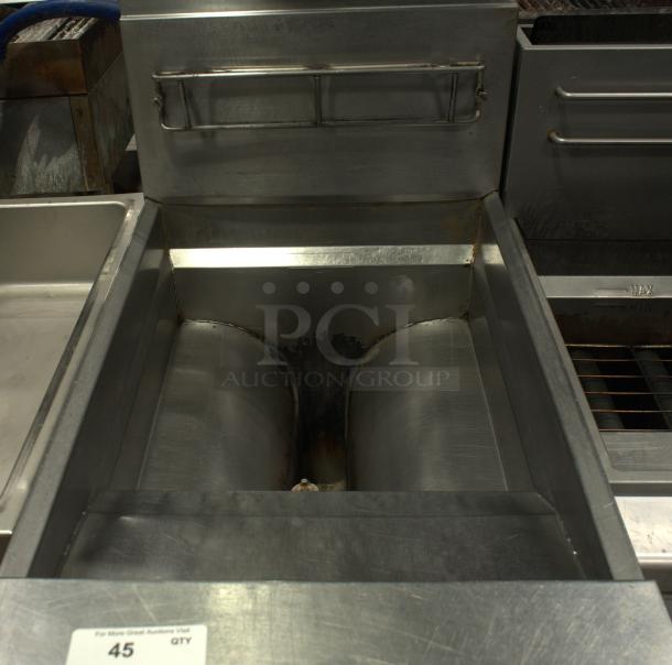 Frymaster heavy-duty commercial deep fryer in used condition, features stainless steel construction and dual vats.
