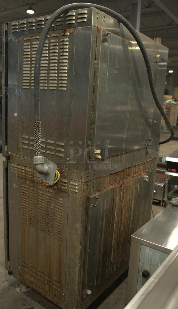 Alto-Shaam AR-7T rotisserie oven, stainless steel, 7 spits, 208V, 3-phase, visible wear, back panel view with vent details.